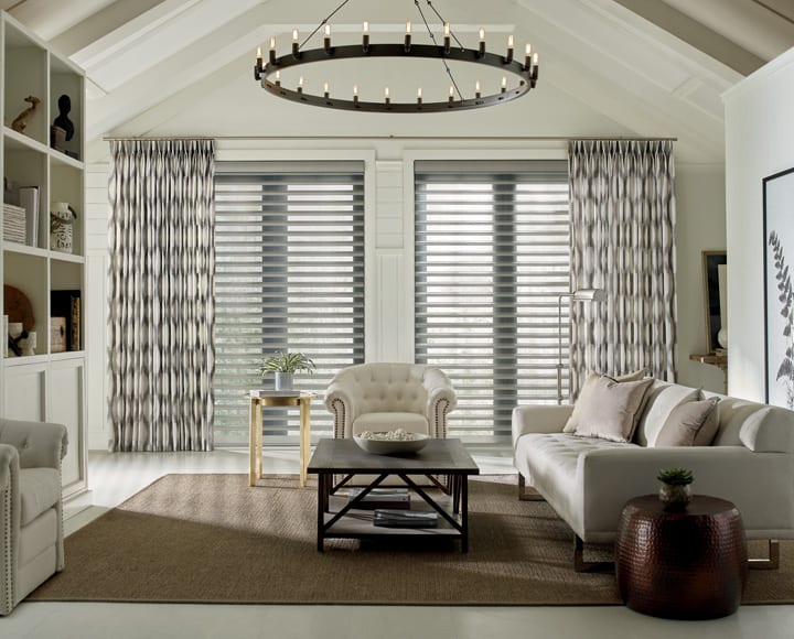 living room with automated drapery panels and pirouette shades in Memorial TX