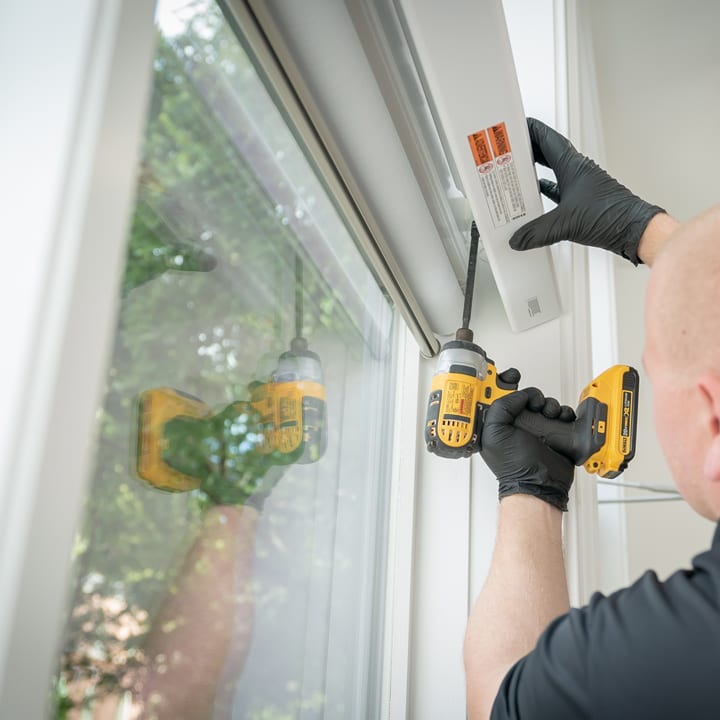 Hunter Douglas installer putting in shades when building a new home in Houston TX