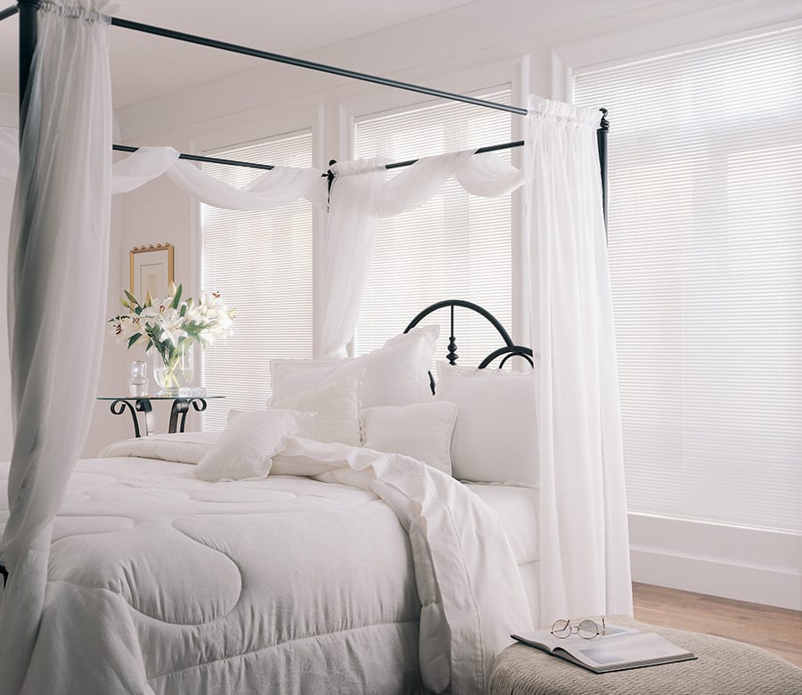 white aluminum blinds in white bedroom Houston TX
