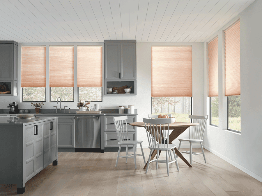 Kitchen with window treatments to filter natural light.