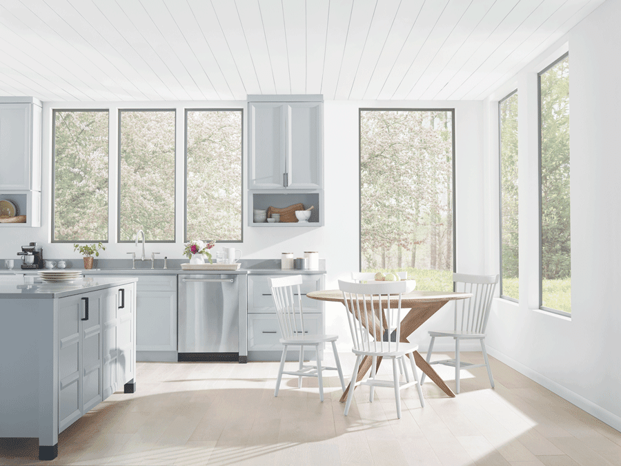 Kitchen with no window treatments is drowning in natural light.