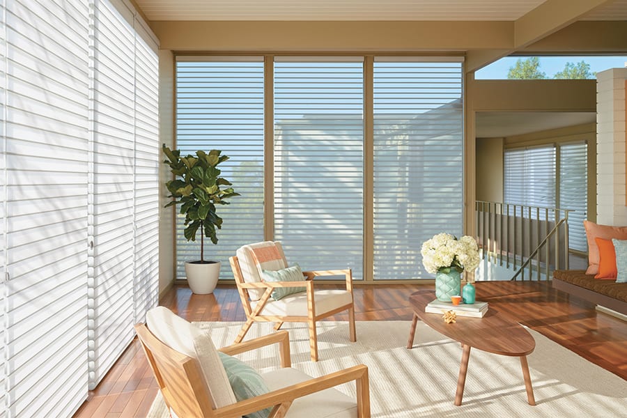 silhouette shades living room with floor to ceiling. windows Houston TX