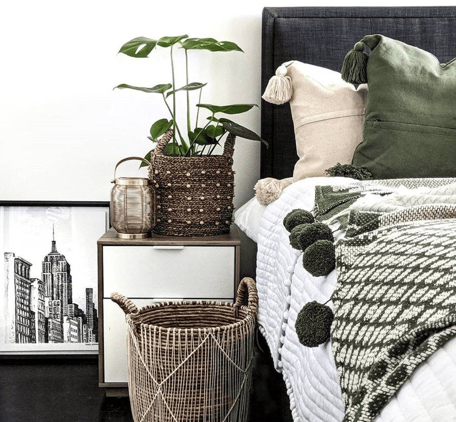 bohemian bedroom styling woven basket blanket with tassels