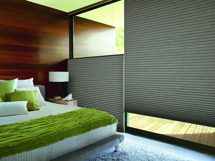 Top-down bottom-up window coverings add privacy to this bedroom