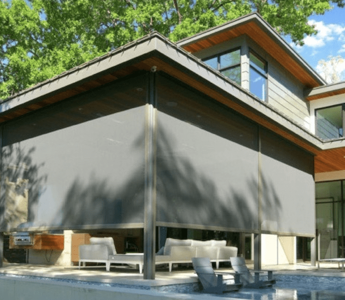 covered-patio-motorized-exterior-shades-houston-Creative-Blinds black exterior shades on covered patio in the woodlands houston TX