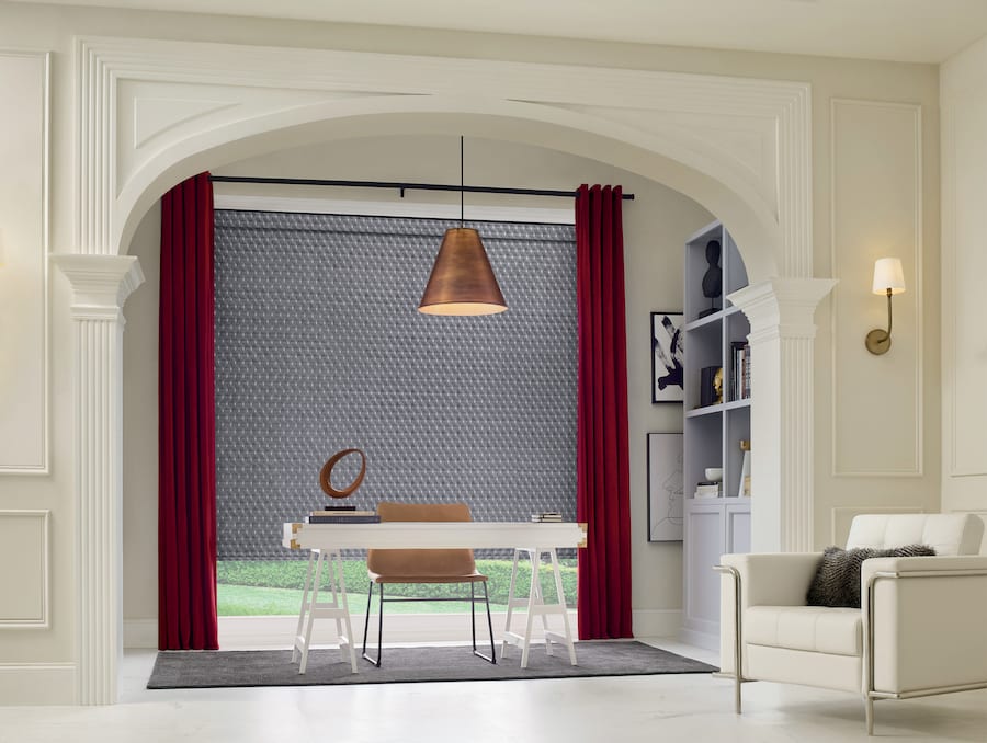 home office nook with large window behind desk roller shades and draperies Baybrook TX