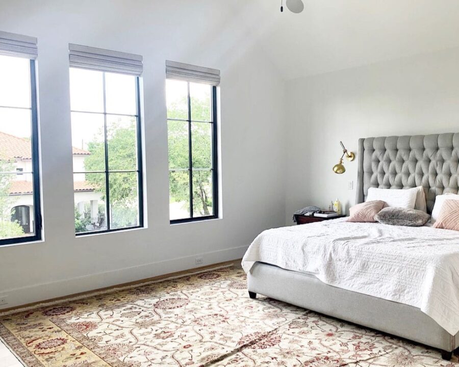 master bedroom with black frame windows and roman shades in Houston TX