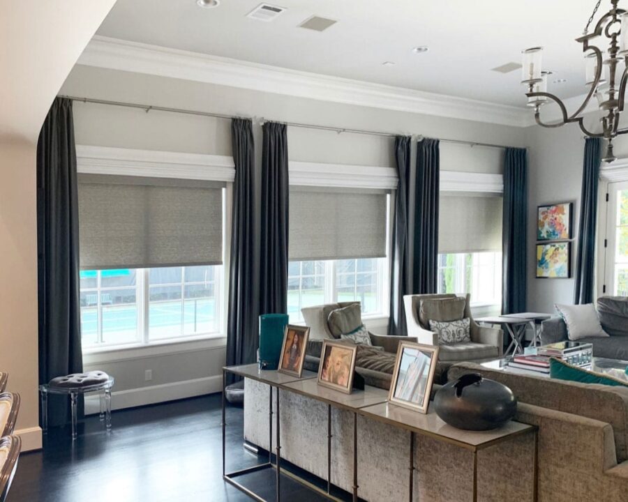 living room ideas for home with dark drapery panels and roller shades in Magnolia TX