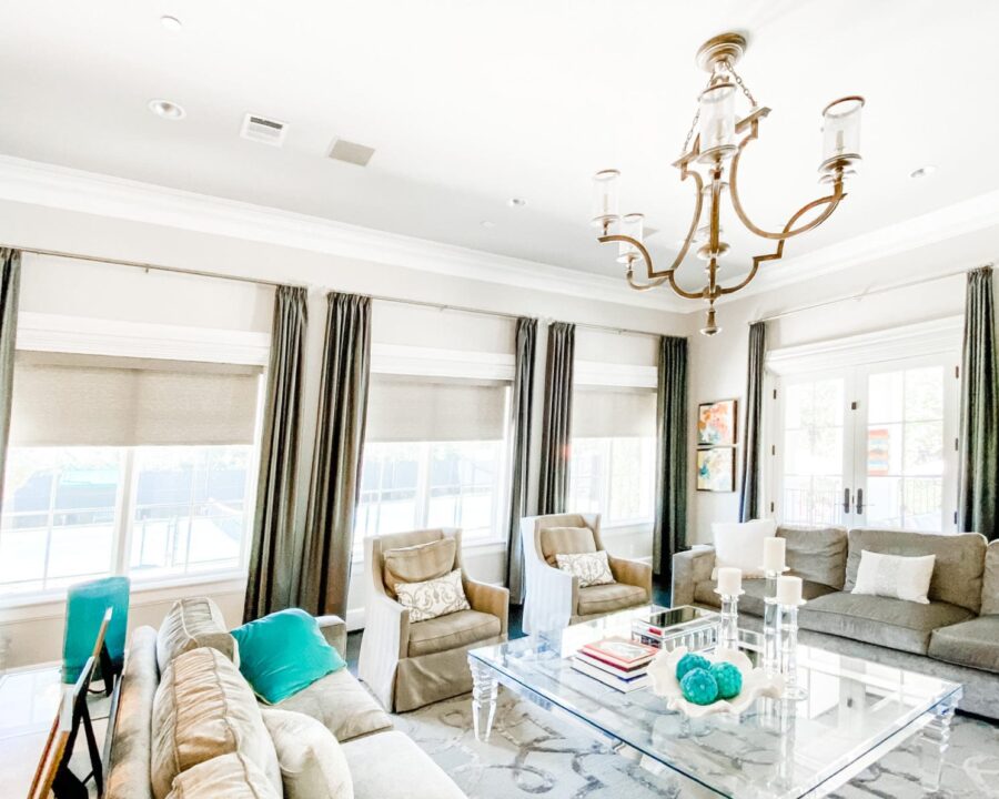 beige roller shades with olive green drapery in Houston living room