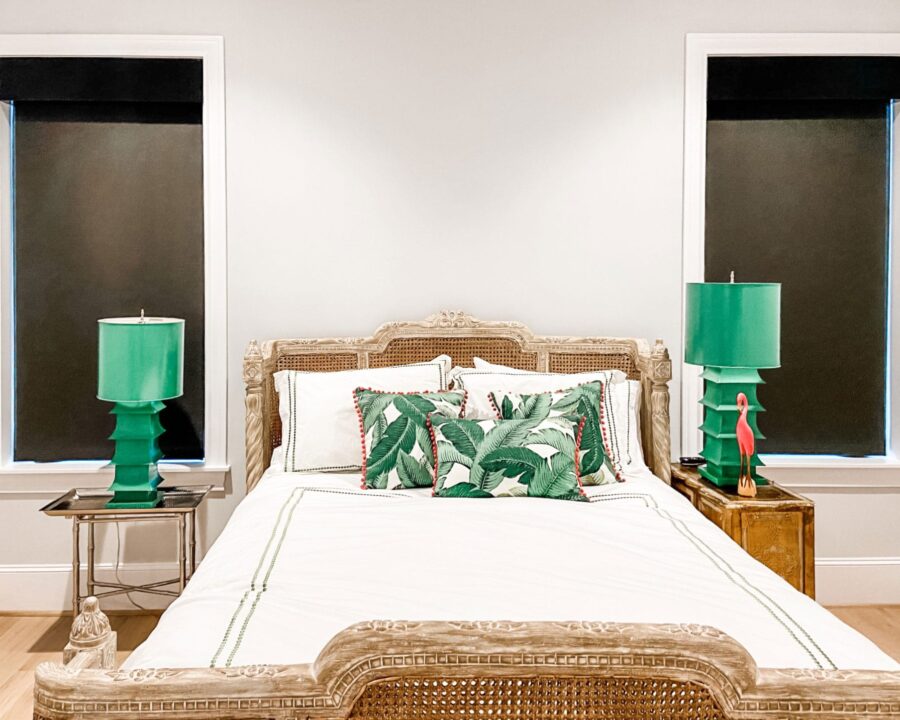 tropical bedroom with black roller shades in Memorial TX