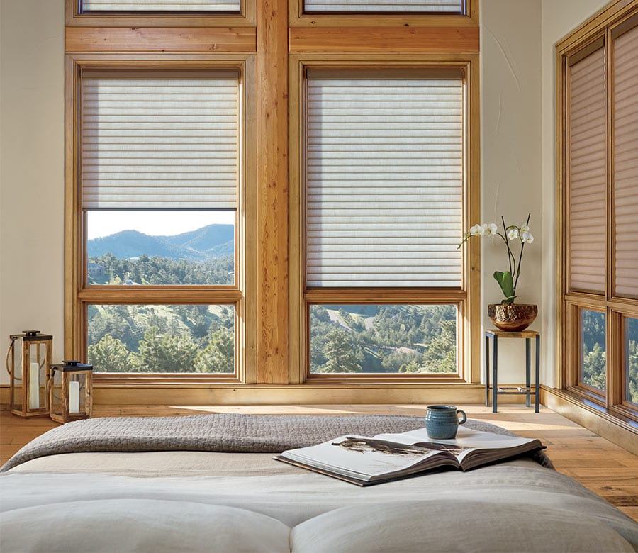 bedroom windows out of reach with beige cellular shades in Magnolia TX