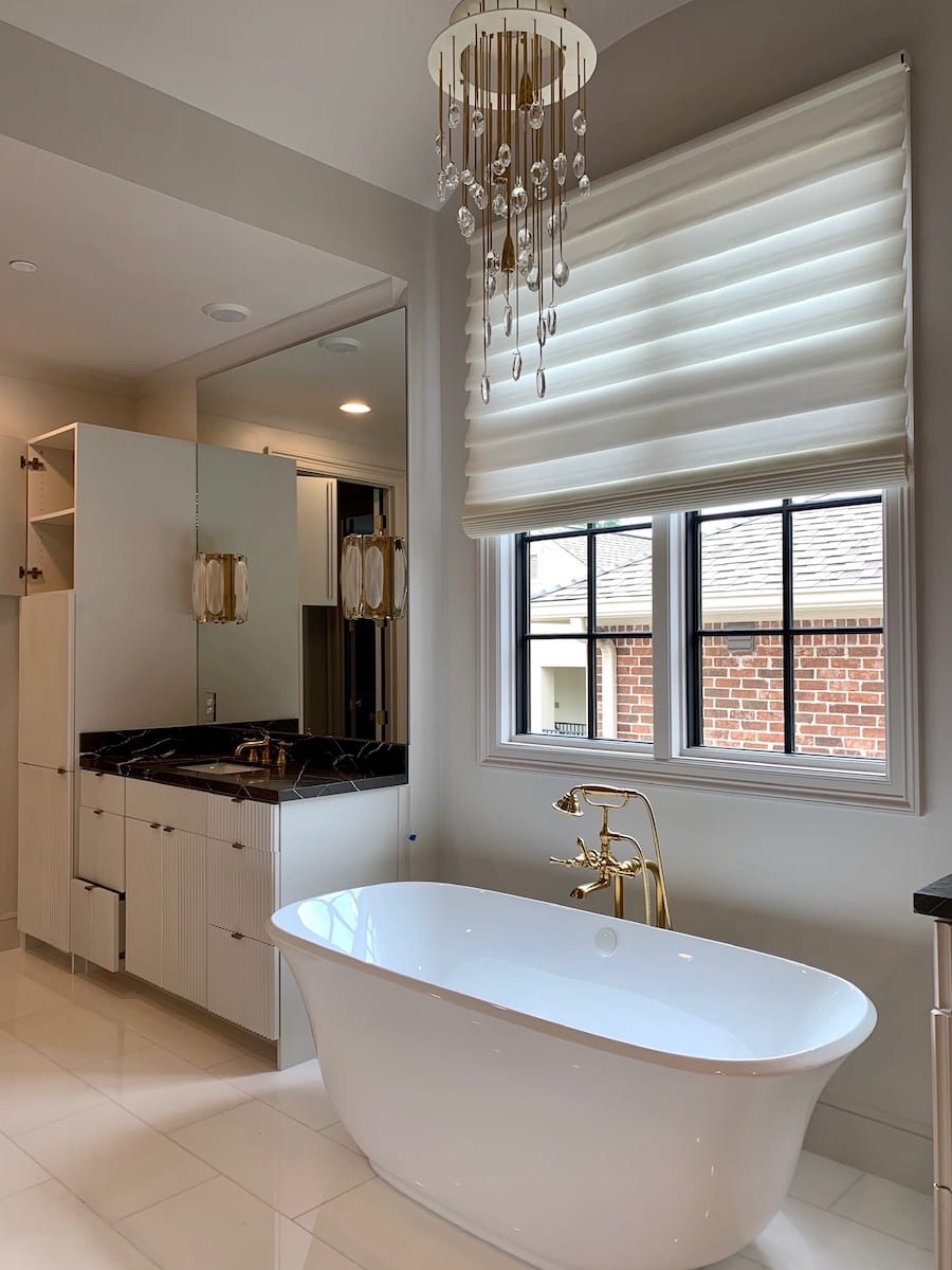 white bathroom with fabric roman shades in Houston TX