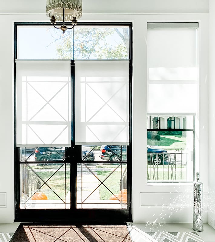 white roller shades on black framed french doors in Memorial TX