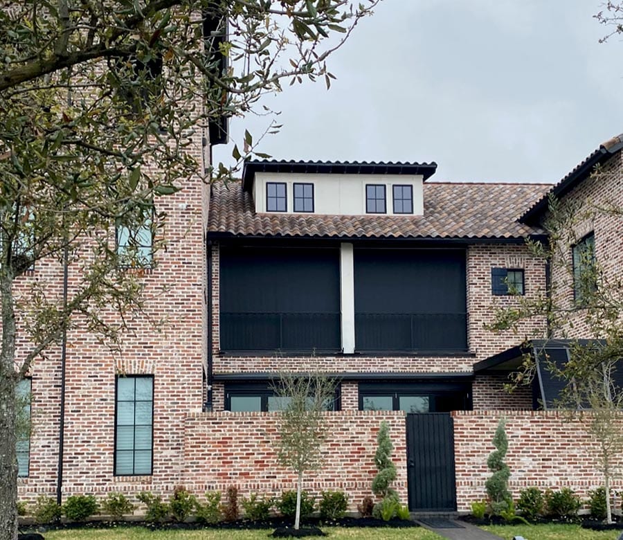 black screen shades on the balcony of home in Baybrook TX