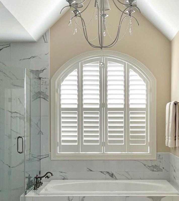 arched window with shutters