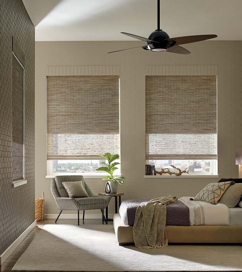 beige bedroom with woven wood shades in Friendswood, 77546