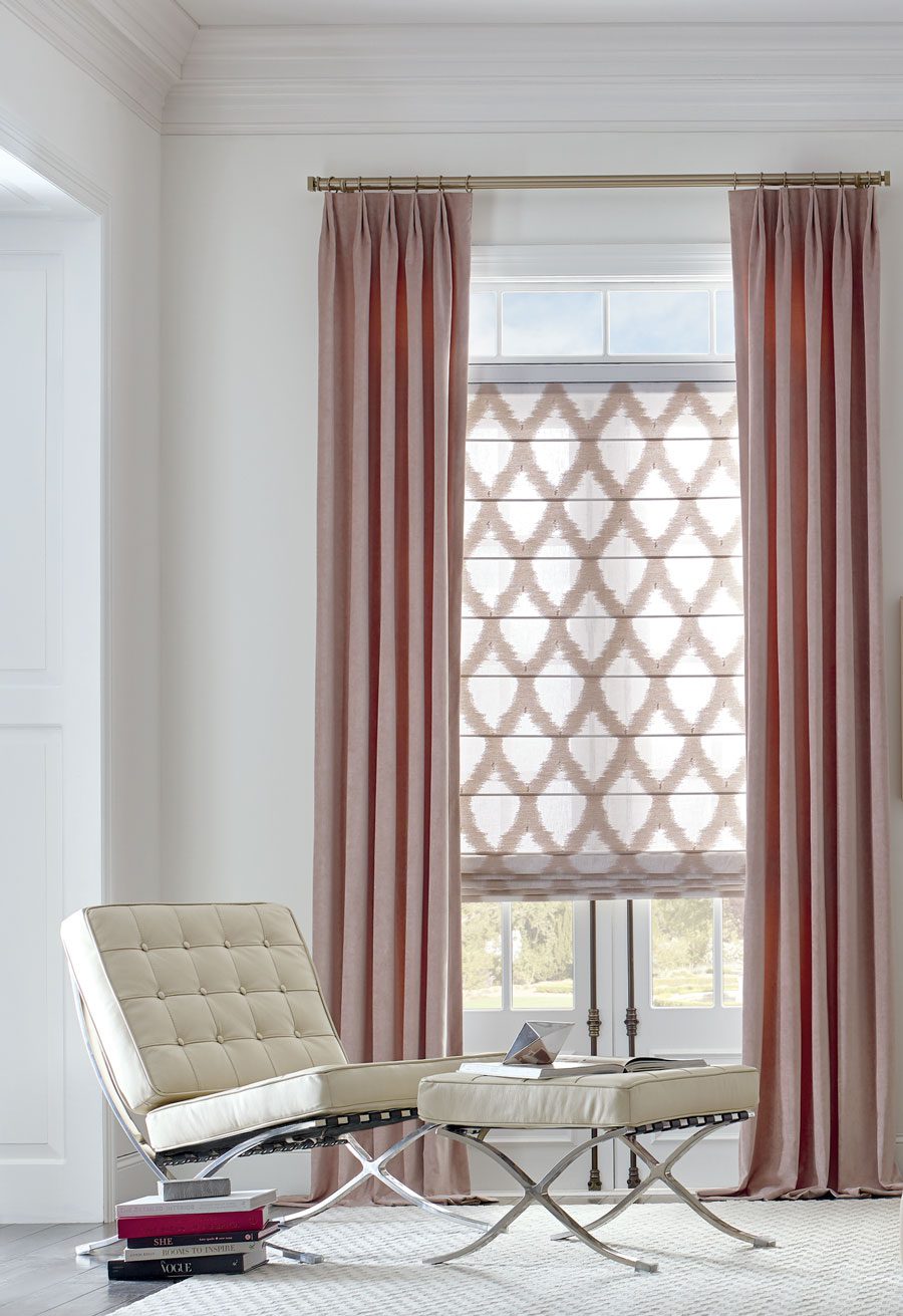 rose colored drapes with patterned fabric roman shades in Baybrook TX