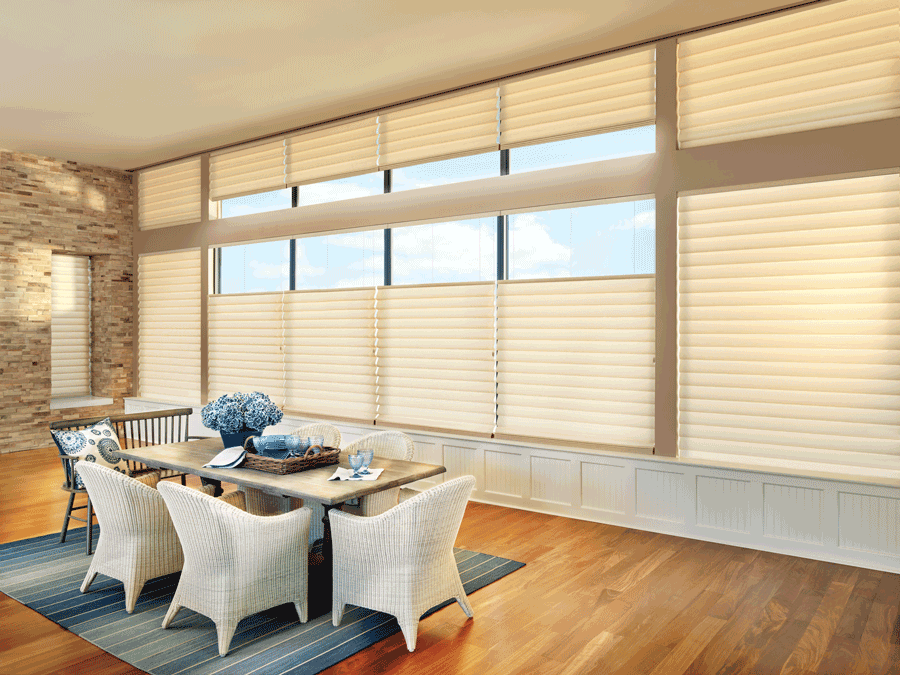 dining room in Houston home with tall windows covered with modern roman shades