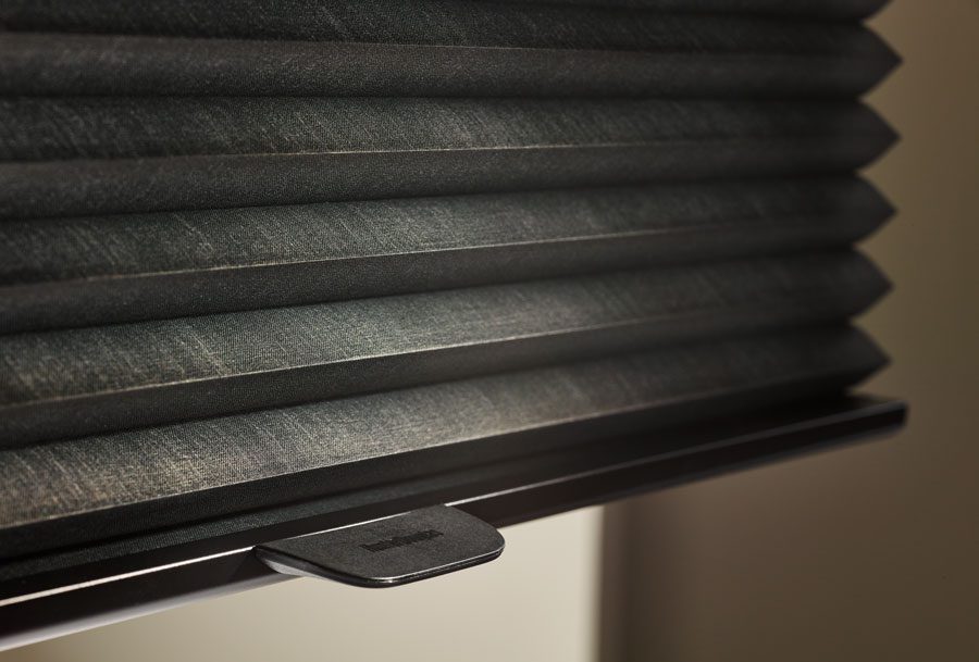 close up of dark fabric honeycomb shades in Houston TX