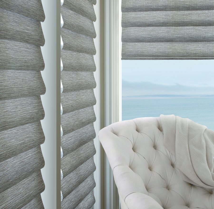 medium gray roman shades paired with white furniture in West U TX