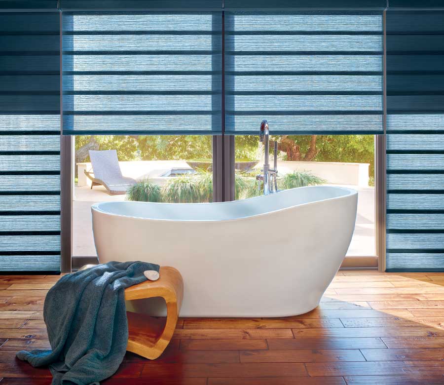 blue jewel toned roman shades in modern bathroom