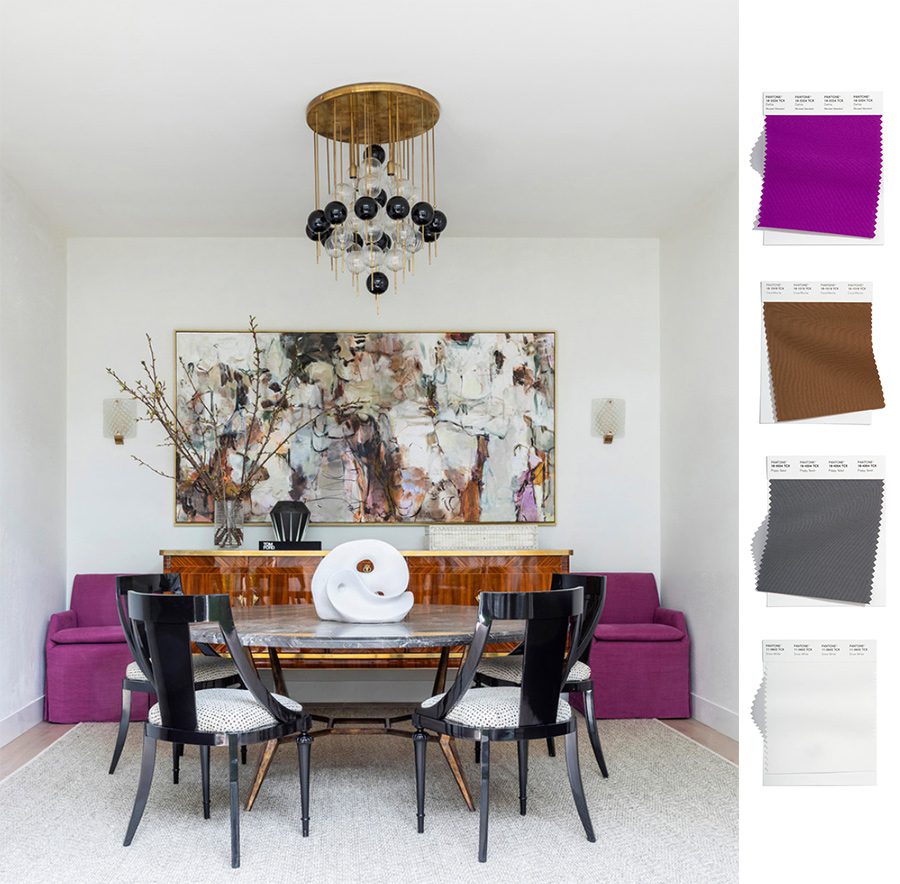 white dining room with bright purple seating and abstract art 