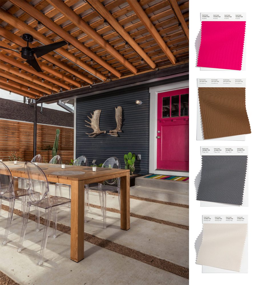 houston area patio with dark gray siding and hot pink door 