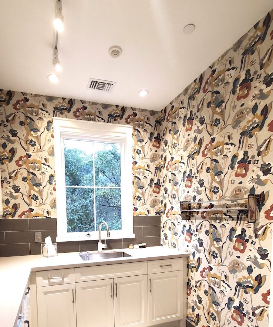 laundry room with colorful wallpaper in Magnolia TX