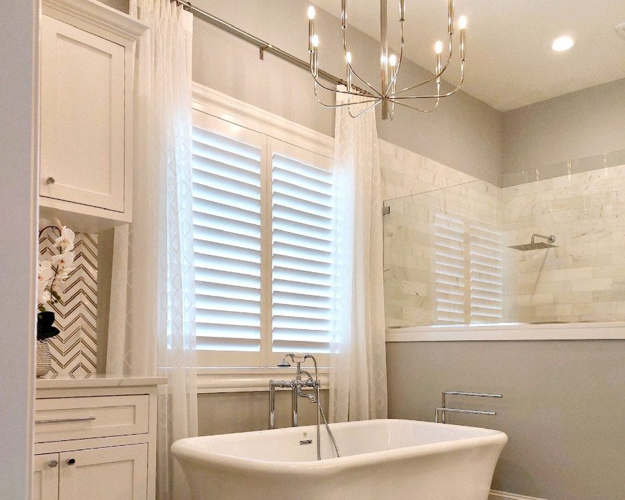 white shutters in white modern bathroom