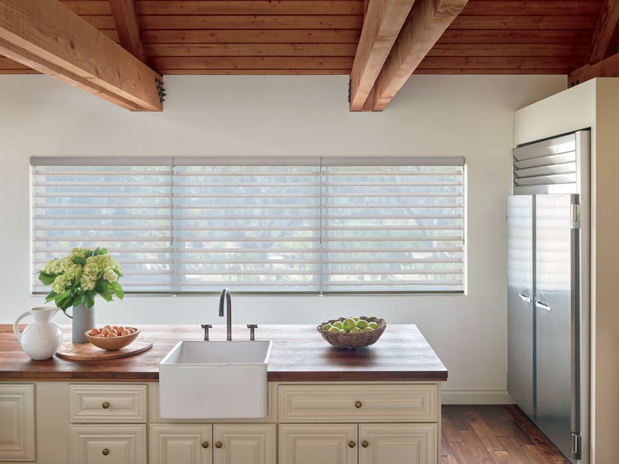 kitchen with motorized sheer shades on windows in Baybrook TX