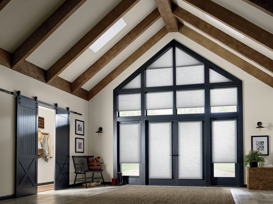 front entryway inspiration for a home with angled ceilings and angled windows with honeycomb shades in Houston TX