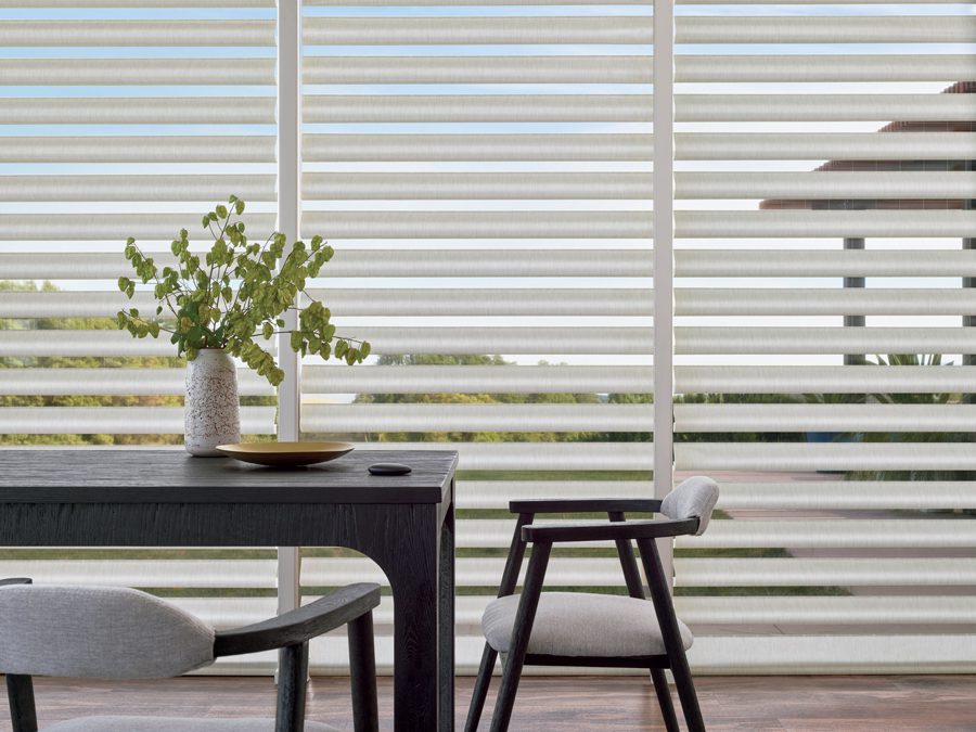 dining room with landscape view through sheer pirouette shades in Memorial TX