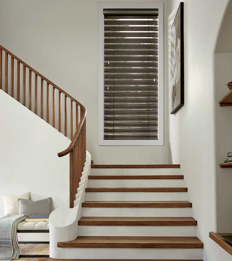 entryway stairs with brown metal blinds in traditional Houston, TX home