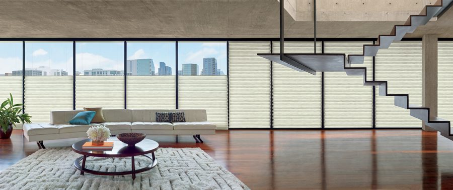 panoramic of houston condo with floor to ceiling windows and top down shades