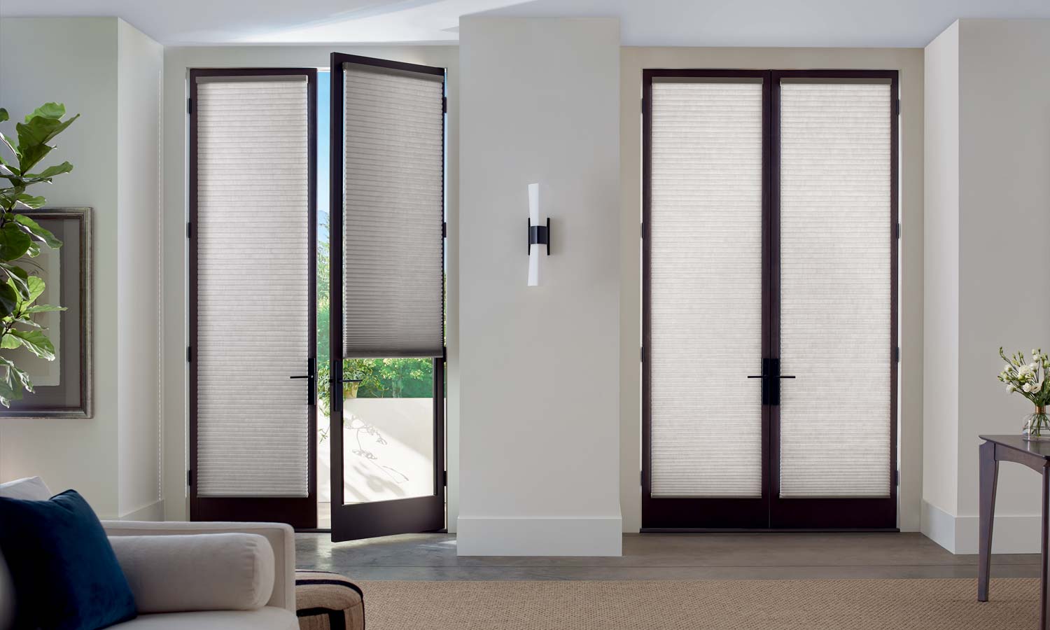 two sets of french doors with honeycomb shades