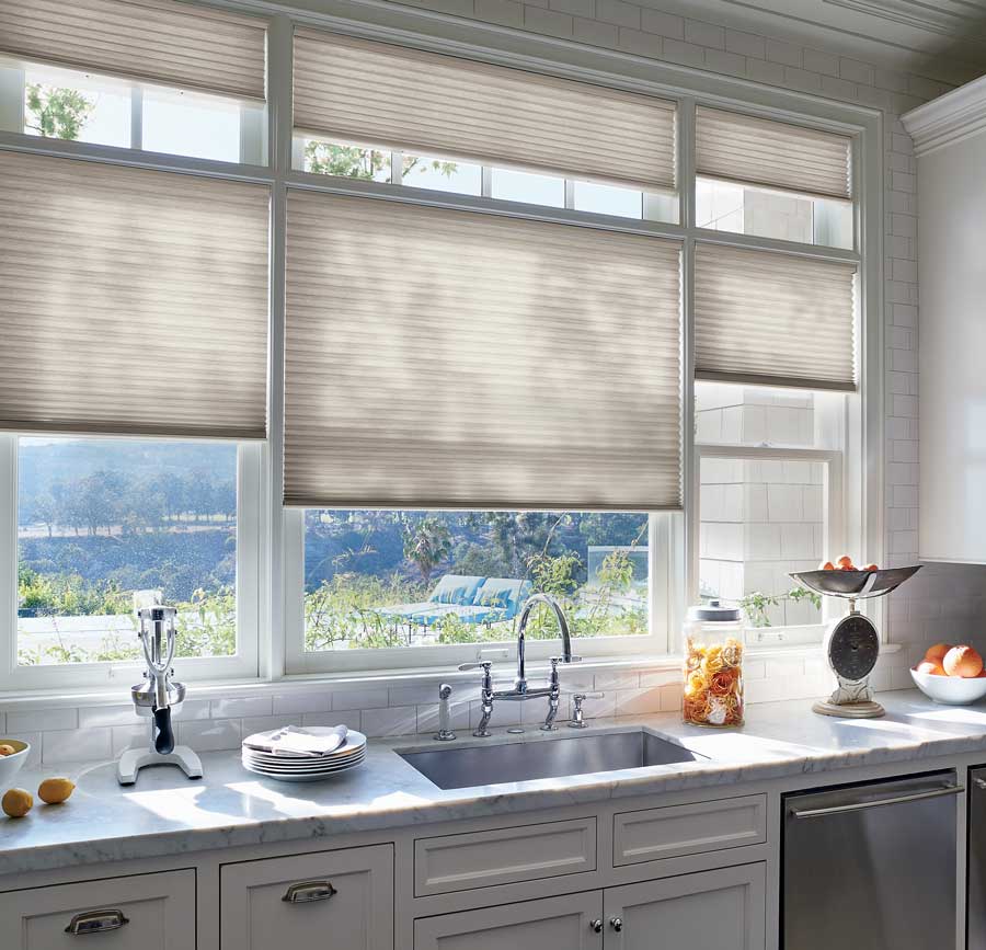 cellular shades as kitchen window coverings over the sink in Houston area home