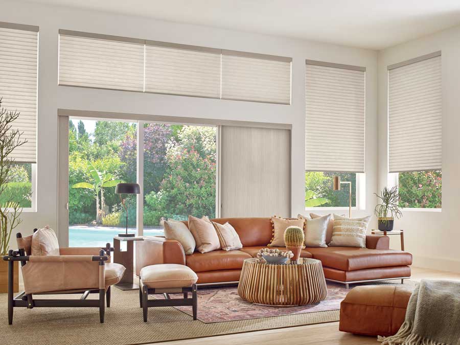 open floor plan with windows and doors covered with coordinated window treatments in Houston TX