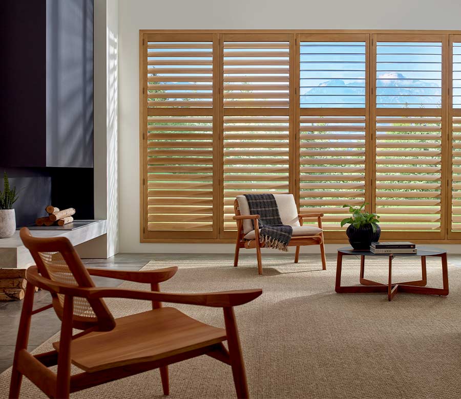 warm hardwood stained shutters floor to ceiling