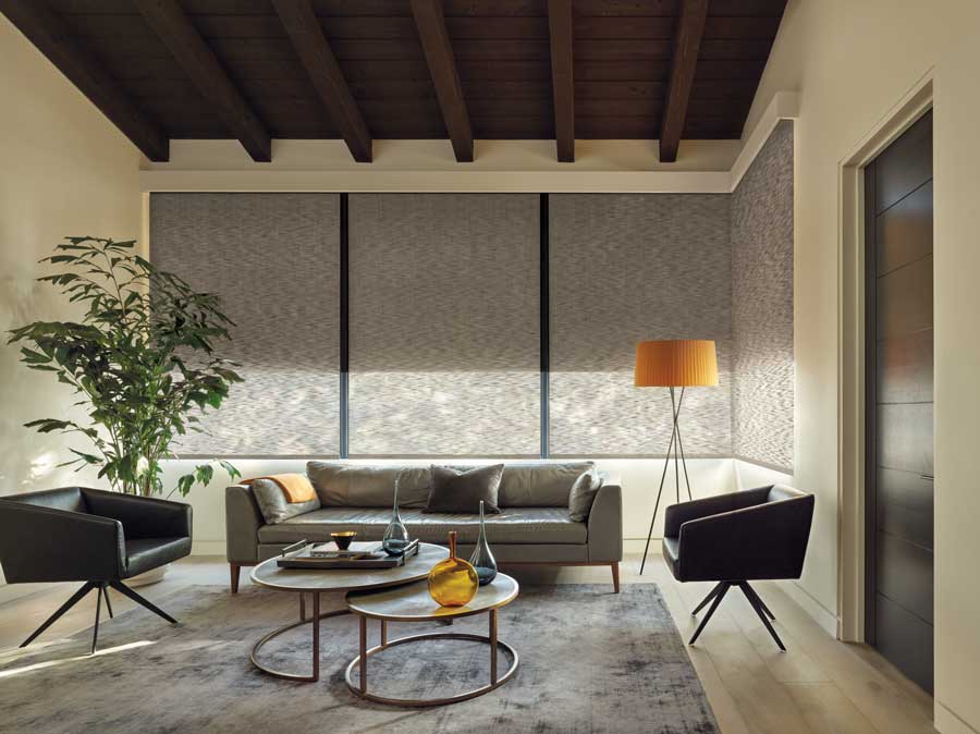 living area with woven shades corner windows