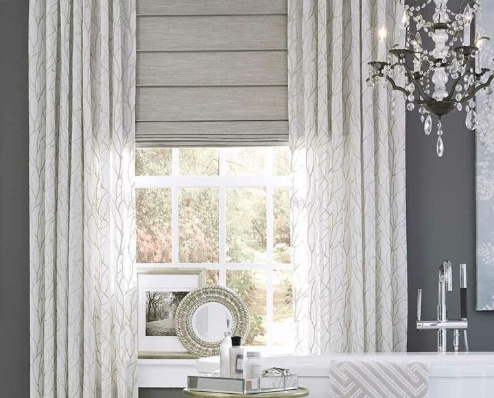 custom window treatments in traditional bathroom with window shades for privacy and light control in Houston TX