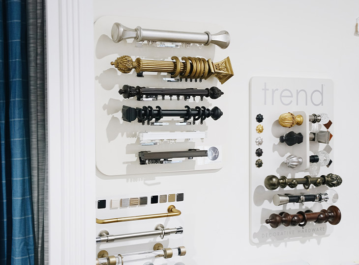 drapery hardware on display in window treatment showroom