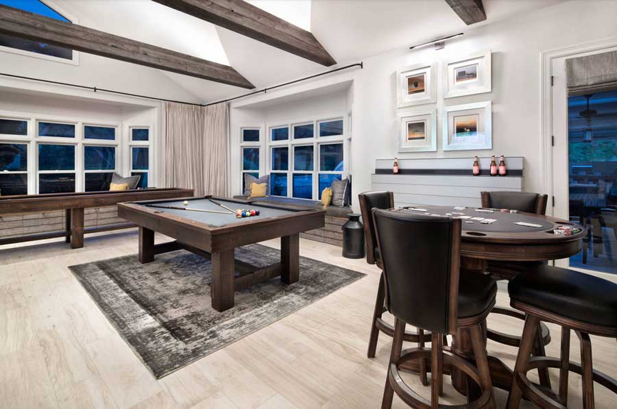 game room with pool table and chairs