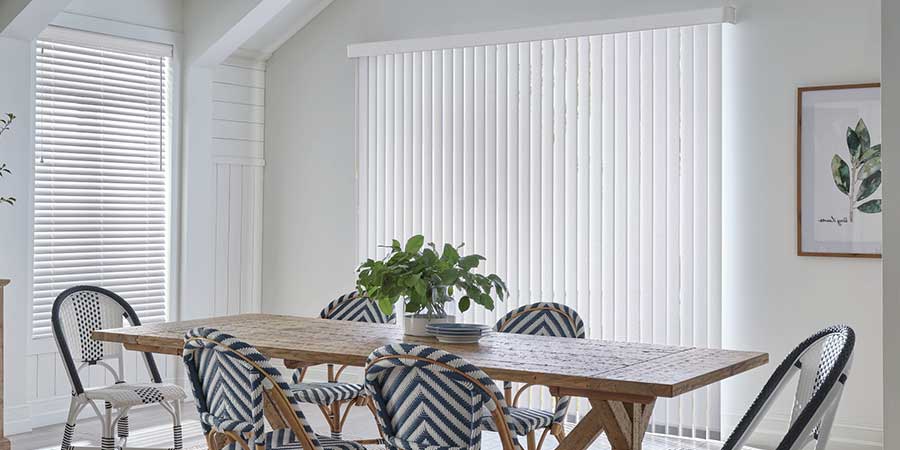 dining room table with white vertical shades