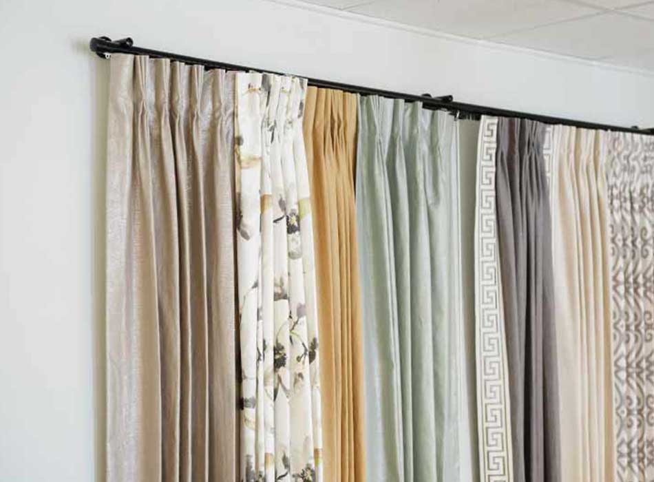 drapery color selections on wall in showroom in baybrook creative blinds