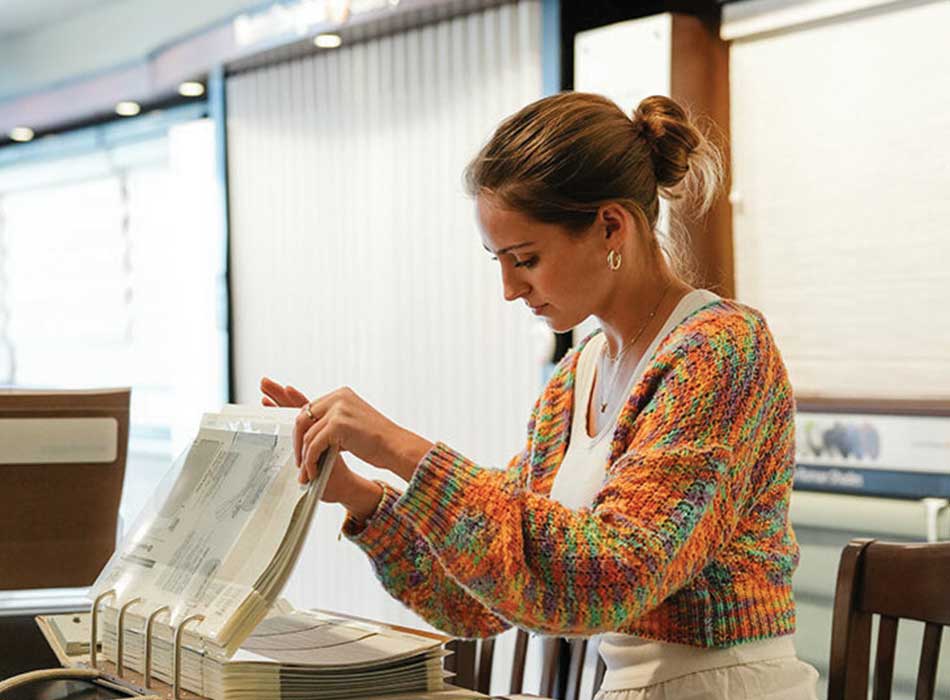customer looking at fabric samples in creative blinds showroom
