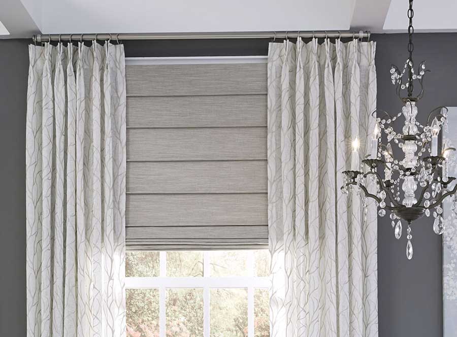 Custom gray shade with pinch pleat drapery Houston TX