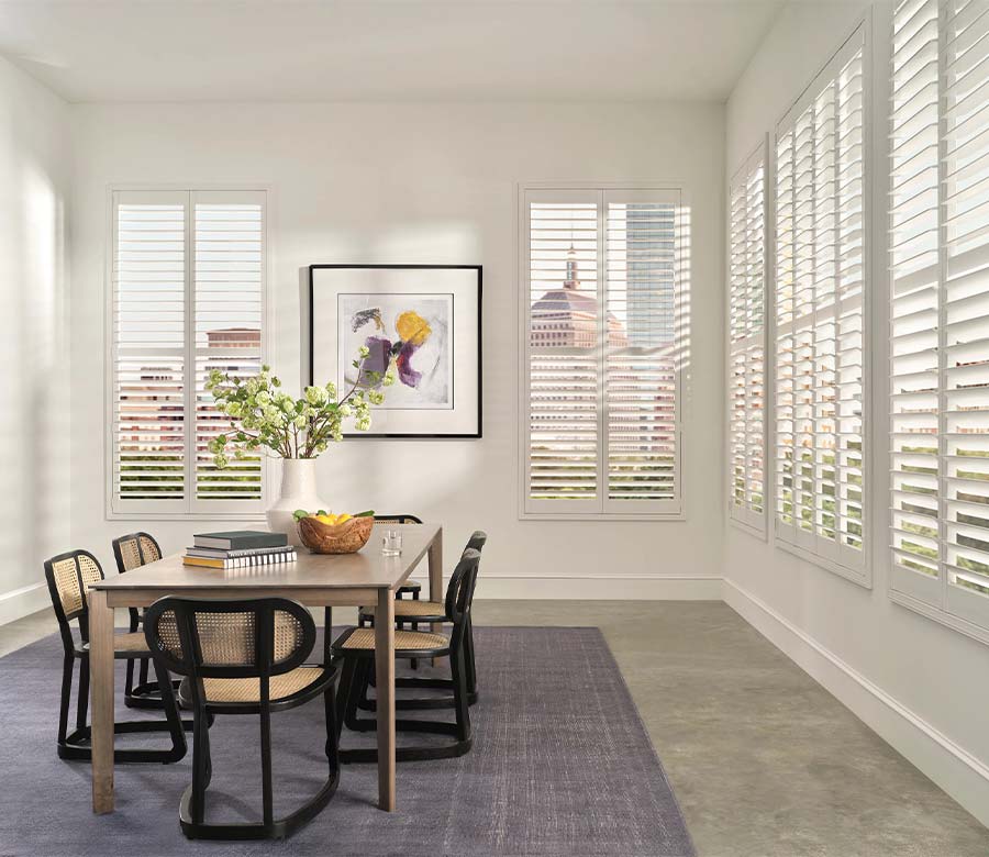 palm-beach-vinyl-dining-room-shutters-hunter-douglas-creative-blinds white palm beach vinyl shutters along wall in dining room