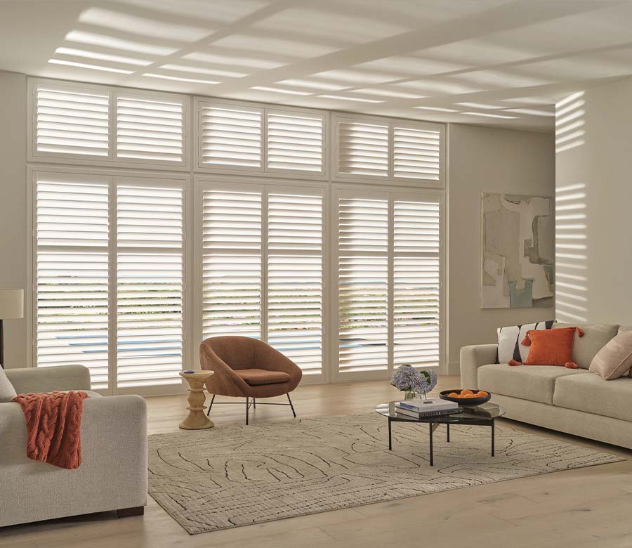 palm-beach-vinyl-shutters-large-windows-hunter-douglas-creative-blinds palm beach vinyl shutters in living room