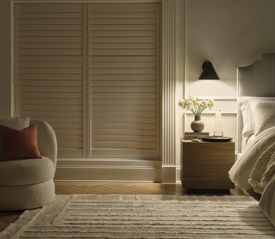 palm-beach-vinyl-shutters-room-darkening-bedroom-shutters-hunter-douglas-creative-blinds dark room with palm beach vinyl shutters in bedroom