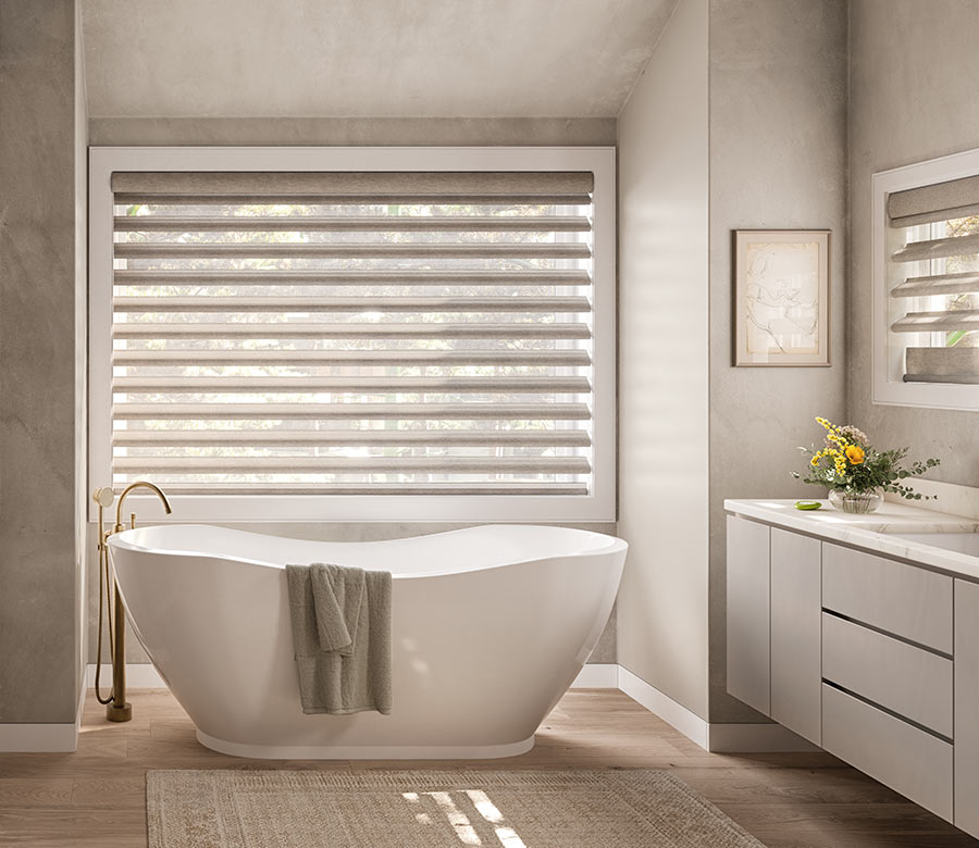 pirouette-window-treatments-primary-bathroom-suite-hunter-douglas-creative-blinds bathroom with tub and pirouette window treatments